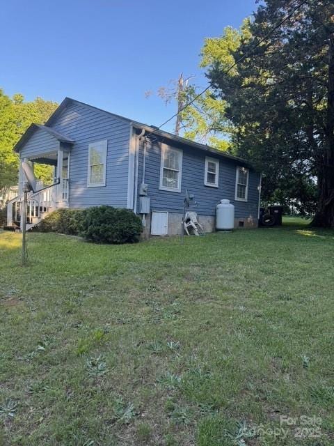 241 Hamrick Dr, Ellenboro, NC 28040 - view of home's exterior with a yard