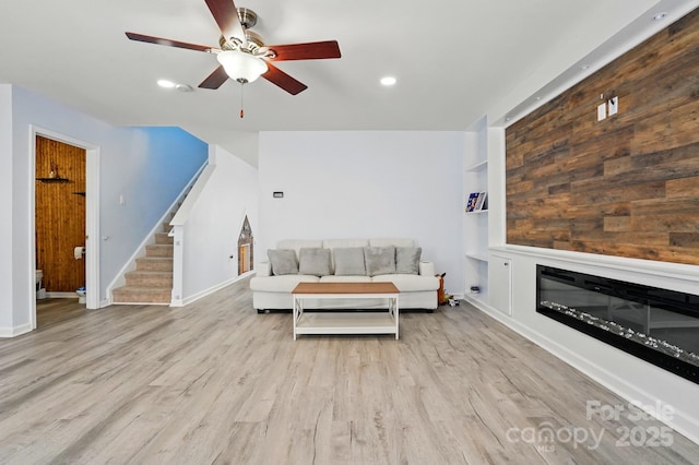1005 Exodus Ct, Monroe, NC 28110 - living area with stairs, ceiling fan, wood finished floors, baseboards, and recessed lighting