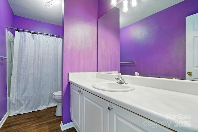 1005 Exodus Ct, Monroe, NC 28110 - full bathroom with toilet, vanity, wood finished floors, and shower / tub combo with curtain