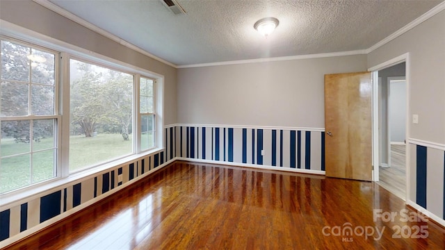 3151 Lynn Mountain Rd, Vale, NC 28168 - empty room featuring wood finished floors, a textured ceiling, crown molding, and baseboards