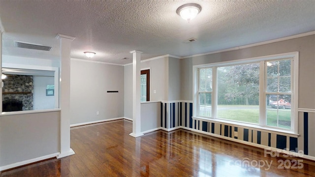 3151 Lynn Mountain Rd, Vale, NC 28168 - spare room with wood finished floors, a textured ceiling, crown molding, wainscoting, and baseboards