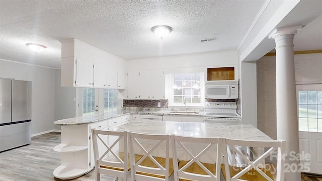 3151 Lynn Mountain Rd, Vale, NC 28168 - kitchen with white appliances, a sink, open shelves, a textured ceiling, and light stone counters