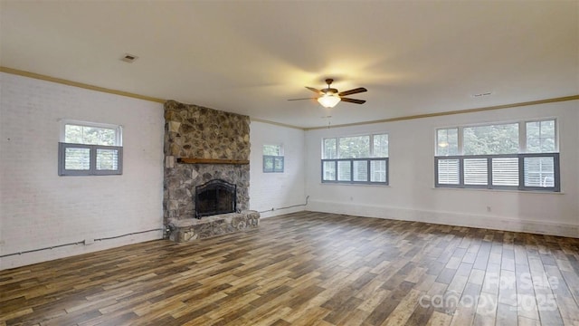 3151 Lynn Mountain Rd, Vale, NC 28168 - unfurnished living room featuring ornamental molding, wood finished floors, ceiling fan, a fireplace, and baseboards