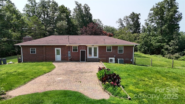 3151 Lynn Mountain Rd, Vale, NC 28168 - rear view of house with french doors, cooling unit, a lawn, decorative driveway, and brick siding