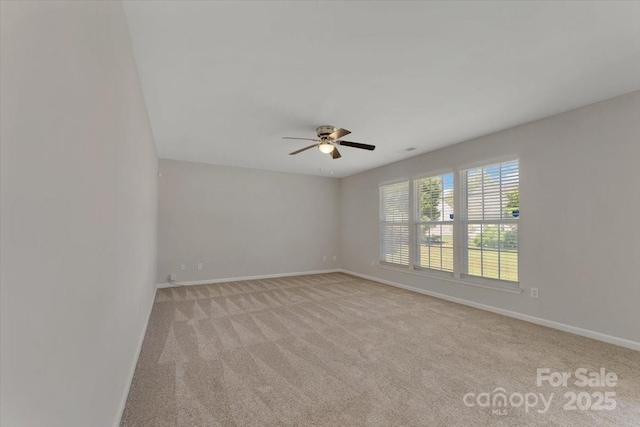 1111 Balcorn Pl, Charlotte, NC 28214 - empty room with light carpet, a ceiling fan, and baseboards