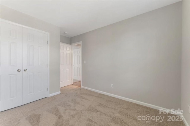 1111 Balcorn Pl, Charlotte, NC 28214 - unfurnished bedroom featuring carpet, baseboards, and a closet