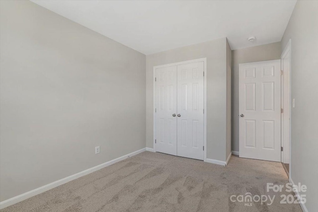 1111 Balcorn Pl, Charlotte, NC 28214 - unfurnished bedroom featuring carpet, baseboards, and a closet