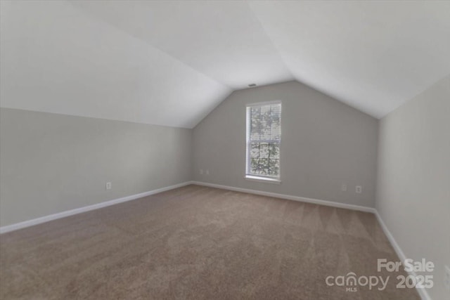 1111 Balcorn Pl, Charlotte, NC 28214 - additional living space featuring carpet flooring, vaulted ceiling, and baseboards