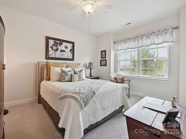 9405 Gladden Hill Ln, Pineville, NC 28134 - bedroom featuring light carpet, baseboards, and a ceiling fan