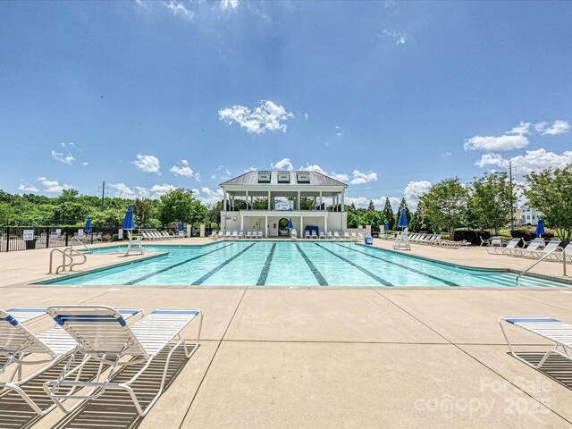 9405 Gladden Hill Ln, Pineville, NC 28134 - community pool featuring a patio