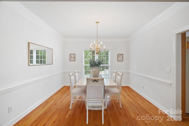 11917 Ulsten Ln, Huntersville, NC 28078 - dining room with a chandelier, light wood-type flooring, and crown molding