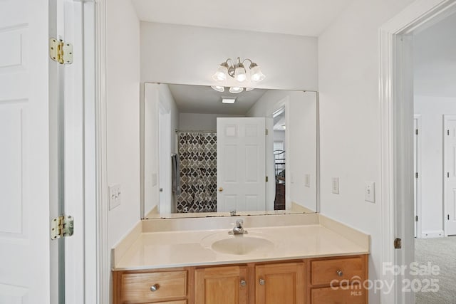 11917 Ulsten Ln, Huntersville, NC 28078 - full bathroom featuring vanity and a chandelier