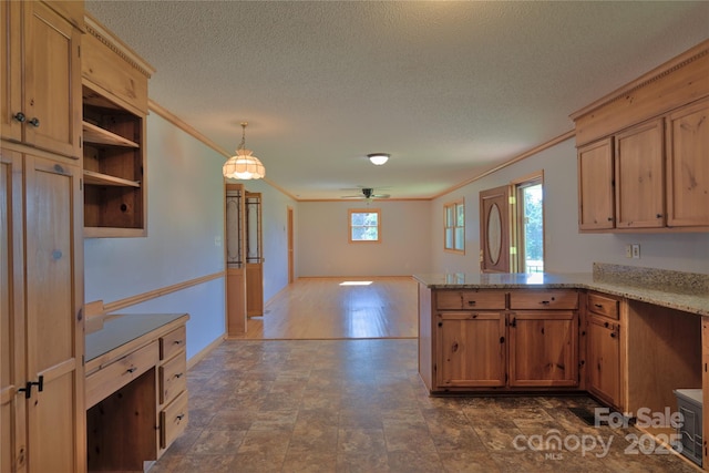 7869 Cherry Point Dr, Denver, NC 28037 - kitchen featuring crown molding, a peninsula, ceiling fan, open floor plan, and light stone counters
