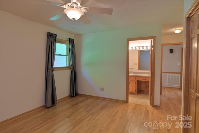 7869 Cherry Point Dr, Denver, NC 28037 - unfurnished bedroom featuring light wood-type flooring, ensuite bath, and ceiling fan