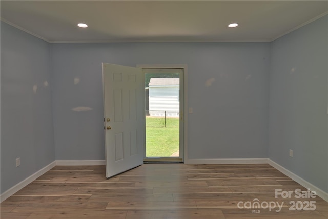 7869 Cherry Point Dr, Denver, NC 28037 - empty room featuring crown molding, plenty of natural light, wood finished floors, and recessed lighting