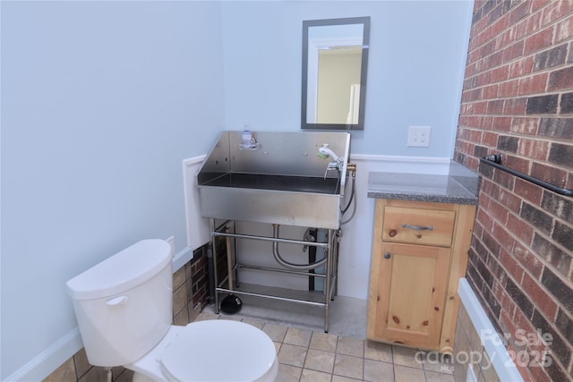 7869 Cherry Point Dr, Denver, NC 28037 - half bath with pet washing station, vanity, and brick wall