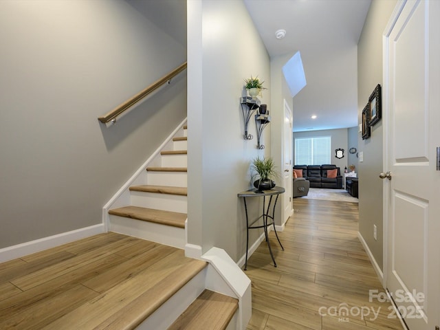 54 Woodsdale Pl SE, Concord, NC 28025 - stairs featuring wood finished floors, baseboards, and recessed lighting