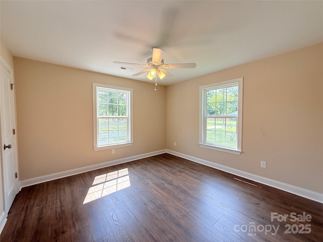 111 W Perry St, Heath Springs, SC 29058 - unfurnished room featuring healthy amount of natural light, dark wood finished floors, and baseboards