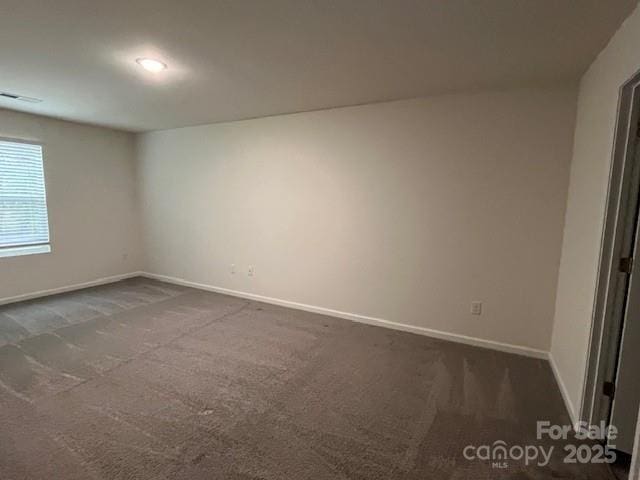 103 Higgins Ct, Morganton, NC 28655 - spare room featuring dark carpet and baseboards
