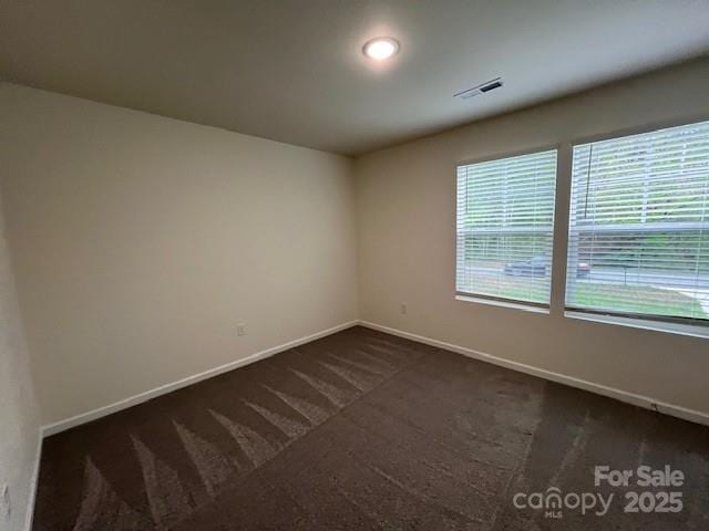 103 Higgins Ct, Morganton, NC 28655 - empty room with baseboards and dark carpet