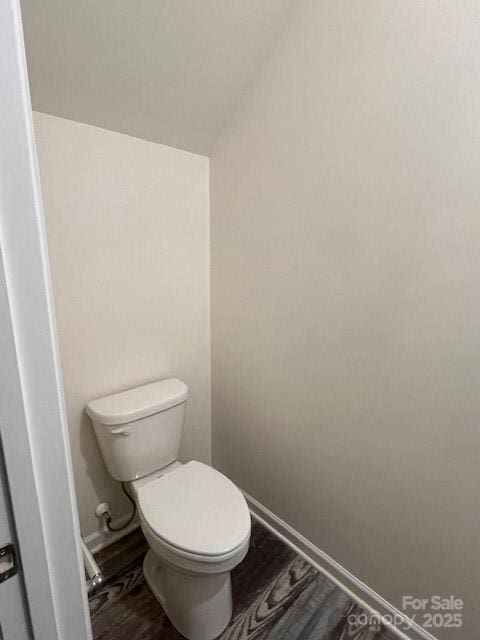 103 Higgins Ct, Morganton, NC 28655 - bathroom featuring toilet, wood finished floors, vaulted ceiling, and baseboards