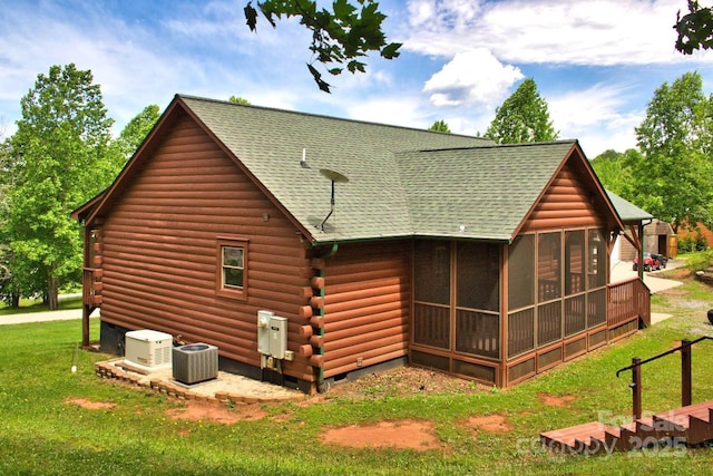 496 Moonlight Pass, Union Mills, NC 28167 - rear view of property featuring a sunroom, log exterior, a shingled roof, and a lawn