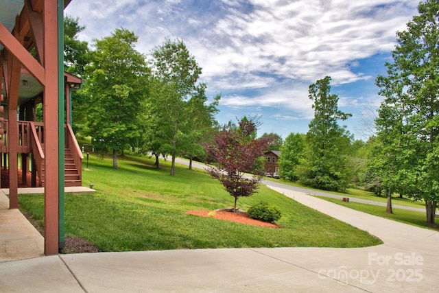 496 Moonlight Pass, Union Mills, NC 28167 - view of green lawn featuring stairs and view of scattered trees