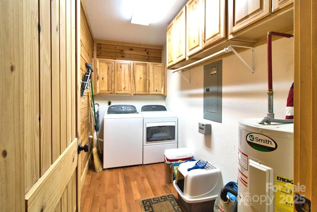 496 Moonlight Pass, Union Mills, NC 28167 - washroom featuring electric water heater, washing machine and clothes dryer, cabinet space, electric panel, and light wood-type flooring
