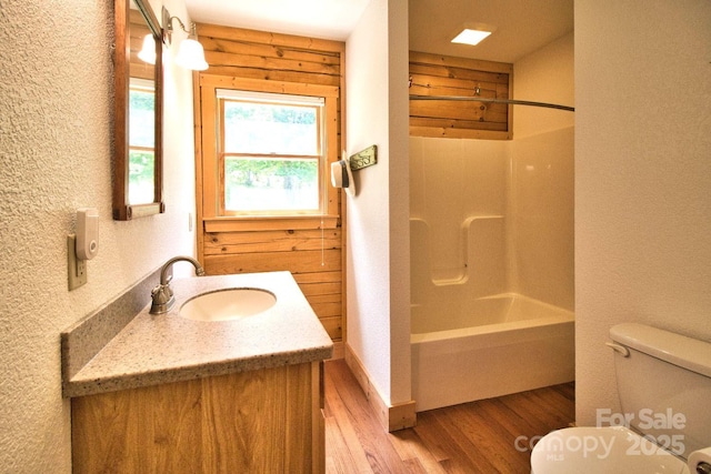 496 Moonlight Pass, Union Mills, NC 28167 - bathroom featuring wood finished floors, vanity, toilet, a textured wall, and washtub / shower combination