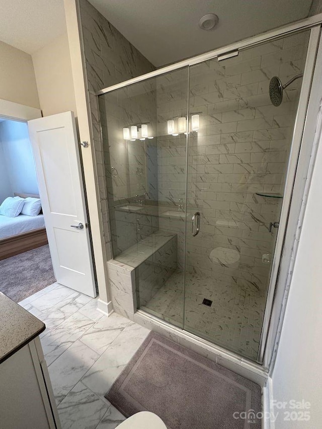 3007 Citizens Ln, Charlotte, NC 28205 - ensuite bathroom with marble finish floors, a shower stall, vanity, and toilet