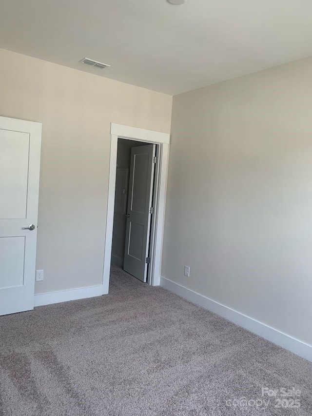3007 Citizens Ln, Charlotte, NC 28205 - carpeted spare room with baseboards