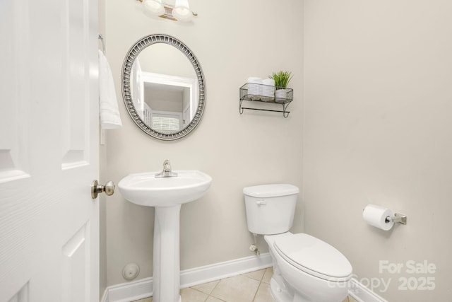 7255 Orchard Path Dr, Clemmons, NC 27012 - bathroom with baseboards, toilet, tile patterned flooring, and a sink