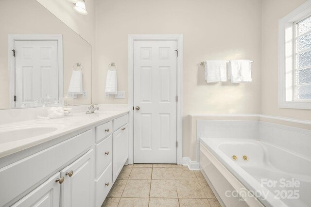 7255 Orchard Path Dr, Clemmons, NC 27012 - full bathroom with a jetted tub, double vanity, tile patterned flooring, and baseboards