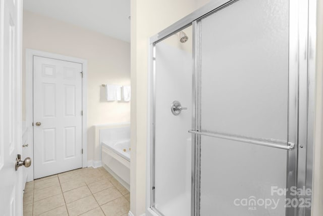 7255 Orchard Path Dr, Clemmons, NC 27012 - bathroom with a bath, a shower stall, tile patterned floors, and baseboards