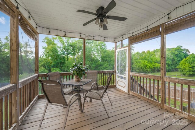 7255 Orchard Path Dr, Clemmons, NC 27012 - deck featuring a ceiling fan, outdoor dining space, and view of wooded area