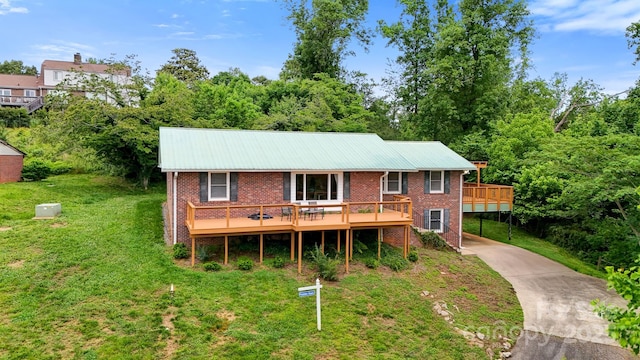 6294 Southlake Dr, Hickory, NC 28601 - view of front facade featuring brick siding, concrete driveway, a deck, and a front yard