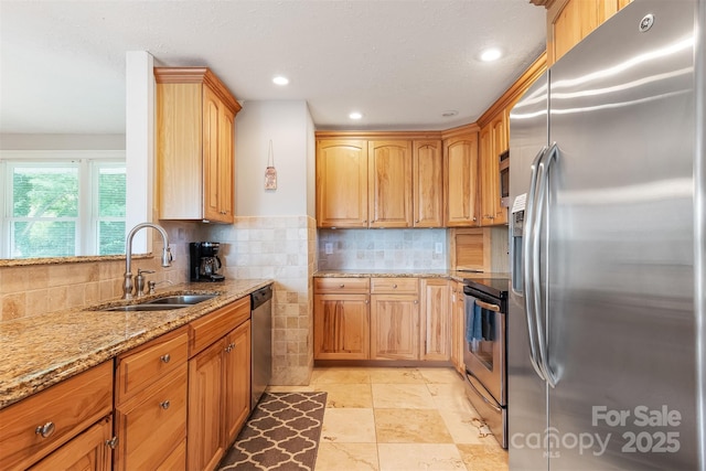 6294 Southlake Dr, Hickory, NC 28601 - kitchen with appliances with stainless steel finishes, a sink, light stone counters, tasteful backsplash, and recessed lighting