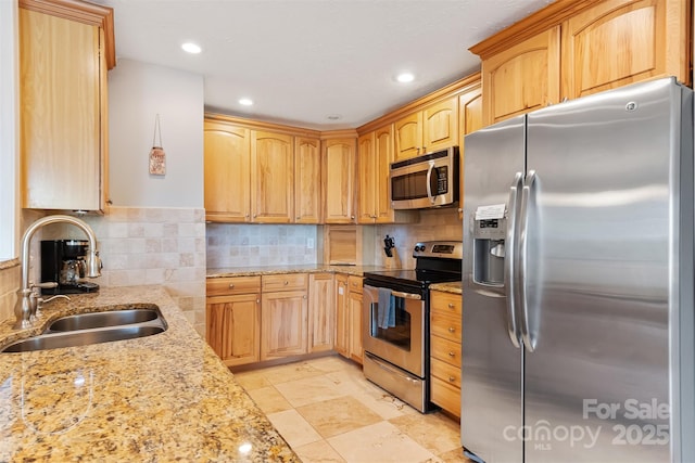 6294 Southlake Dr, Hickory, NC 28601 - kitchen featuring stainless steel appliances, a sink, light stone countertops, backsplash, and recessed lighting