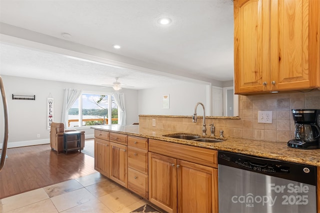 6294 Southlake Dr, Hickory, NC 28601 - kitchen featuring stainless steel dishwasher, a sink, light stone countertops, backsplash, and recessed lighting