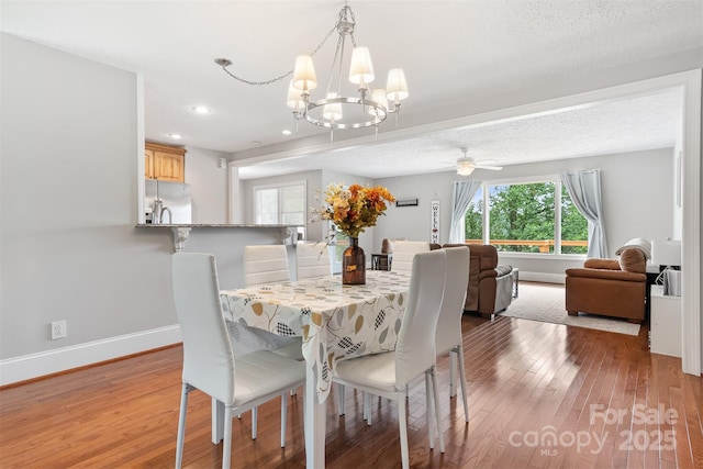 6294 Southlake Dr, Hickory, NC 28601 - dining space with light wood-style flooring, a chandelier, baseboards, recessed lighting, and ceiling fan