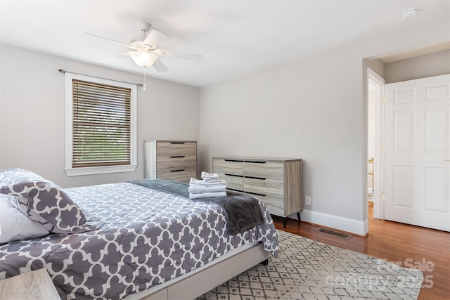 6294 Southlake Dr, Hickory, NC 28601 - bedroom featuring wood finished floors, ceiling fan, and baseboards