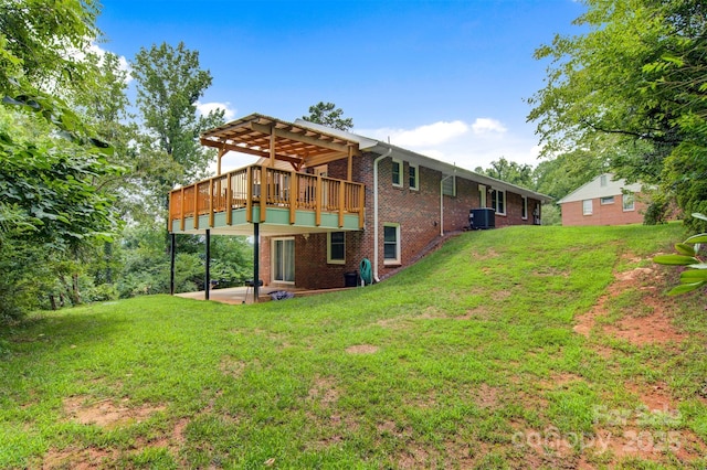 6294 Southlake Dr, Hickory, NC 28601 - back of house featuring brick siding, a yard, central AC unit, a wooden deck, and a patio