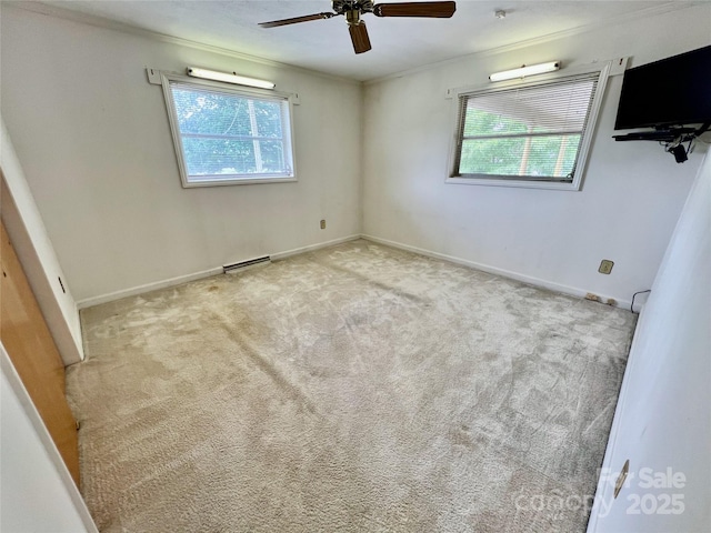 1585 Salem Church Rd, Lincolnton, NC 28092 - spare room featuring plenty of natural light, a ceiling fan, ornamental molding, carpet floors, and baseboards