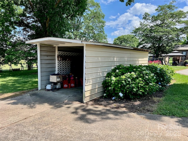 1585 Salem Church Rd, Lincolnton, NC 28092 - garage with driveway and a detached carport