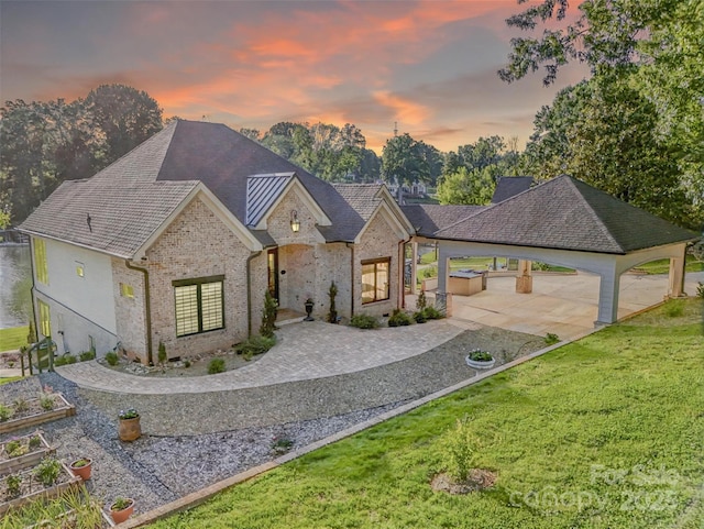 445 Sundown Rd, Mooresville, NC 28117 - view of front of house featuring a front yard, brick siding, and roof with shingles