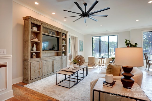 445 Sundown Rd, Mooresville, NC 28117 - living room featuring light wood-style floors, a ceiling fan, crown molding, recessed lighting, and baseboards
