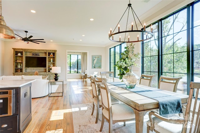 445 Sundown Rd, Mooresville, NC 28117 - dining room with light wood-type flooring, recessed lighting, ornamental molding, a chandelier, and a ceiling fan