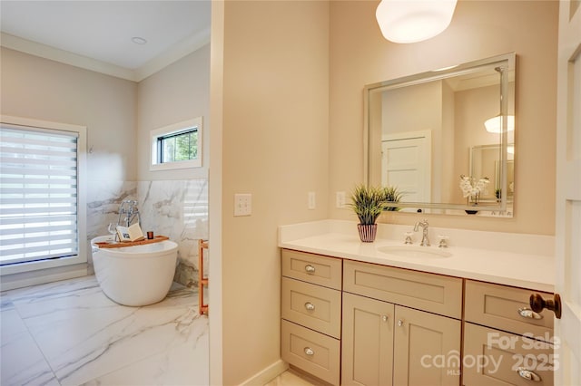 445 Sundown Rd, Mooresville, NC 28117 - bathroom with marble tiled floors, a freestanding tub, and vanity