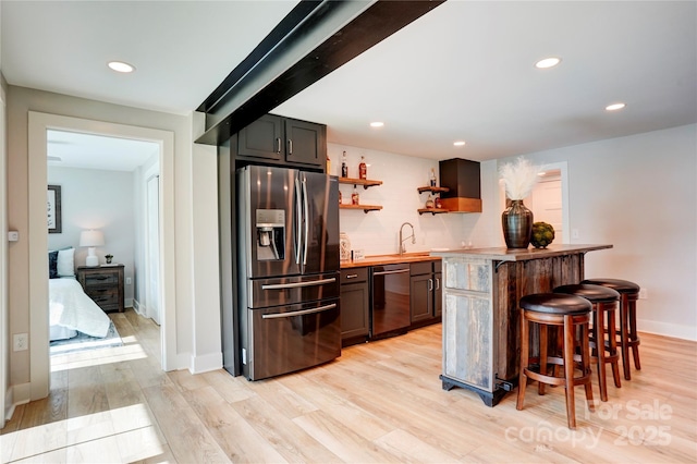 445 Sundown Rd, Mooresville, NC 28117 - kitchen featuring stainless steel fridge, dishwashing machine, wood counters, a breakfast bar, and a sink