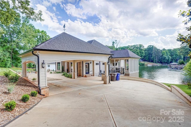 445 Sundown Rd, Mooresville, NC 28117 - rear view of house featuring roof with shingles and a water view